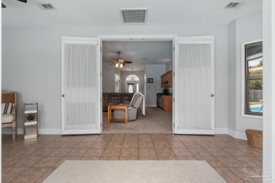 Welcome to your dream home at 3849 Saber Tooth Circle, nestled on Tiger Point Golf and Country Club in Florida - for sale on GolfHomes.com, golf home, golf lot
