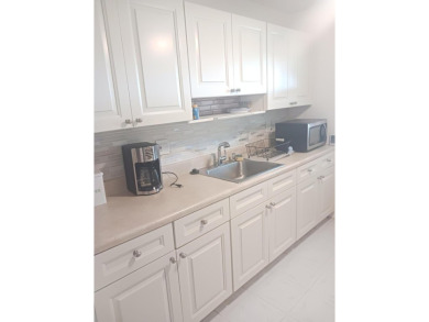 Fall in love with this 2Br/2Ba corner villa is ideally located on Leisureville Community Golf Course in Florida - for sale on GolfHomes.com, golf home, golf lot
