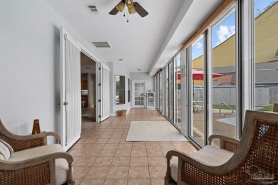 Welcome to your dream home at 3849 Saber Tooth Circle, nestled on Tiger Point Golf and Country Club in Florida - for sale on GolfHomes.com, golf home, golf lot