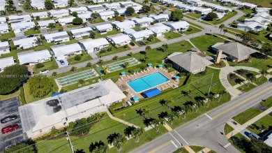 Welcome home to this cozy and bright corner villa condo in the on Leisureville Community Golf Course in Florida - for sale on GolfHomes.com, golf home, golf lot