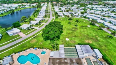 Welcome home to this cozy and bright corner villa condo in the on Leisureville Community Golf Course in Florida - for sale on GolfHomes.com, golf home, golf lot