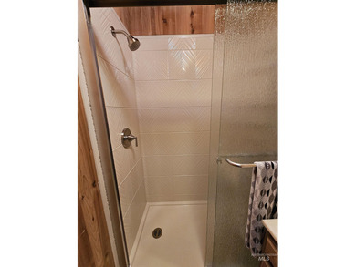 Cute as a button cabin in a great in town location! This 3 on McCall Municipal Golf Course in Idaho - for sale on GolfHomes.com, golf home, golf lot