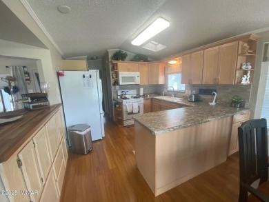LOCATION LOCATION !   This lovely updated home is located on the on Juniper Ridge R.V. Golf Resort in Arizona - for sale on GolfHomes.com, golf home, golf lot