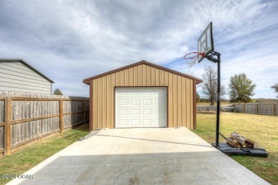 GOLF COURSE VIEW!  Enjoy this inviting 4-bedroom, 2-bath home on Neosho Municipal Golf Course in Missouri - for sale on GolfHomes.com, golf home, golf lot