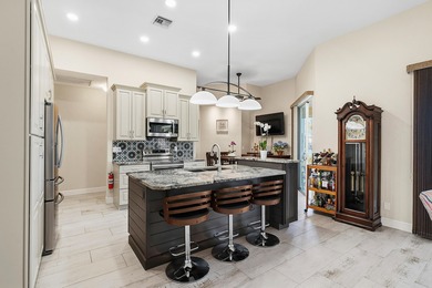 Experience refined living in this beautifully updated pool home on St. Lucie Trail Golf Club in Florida - for sale on GolfHomes.com, golf home, golf lot