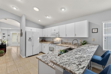 CUTE AS A BUTTON. METICULOUSLY MAINTAINED. GATED COMMUNITY WITH on Meadow Oaks Golf and Country Club in Florida - for sale on GolfHomes.com, golf home, golf lot