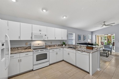 CUTE AS A BUTTON. METICULOUSLY MAINTAINED. GATED COMMUNITY WITH on Meadow Oaks Golf and Country Club in Florida - for sale on GolfHomes.com, golf home, golf lot