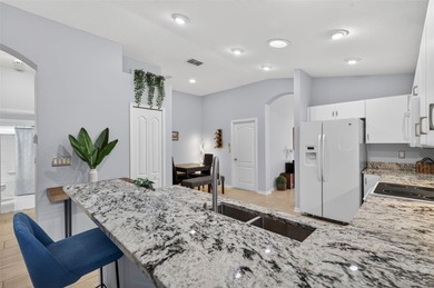 CUTE AS A BUTTON. METICULOUSLY MAINTAINED. GATED COMMUNITY WITH on Meadow Oaks Golf and Country Club in Florida - for sale on GolfHomes.com, golf home, golf lot