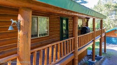 Escape to your own hand-hewn log retreat nestled in the woods of on Star Valley RV Golf Course in Wyoming - for sale on GolfHomes.com, golf home, golf lot