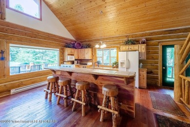 Escape to your own hand-hewn log retreat nestled in the woods of on Star Valley RV Golf Course in Wyoming - for sale on GolfHomes.com, golf home, golf lot