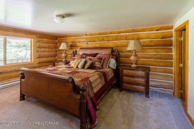 Escape to your own hand-hewn log retreat nestled in the woods of on Star Valley RV Golf Course in Wyoming - for sale on GolfHomes.com, golf home, golf lot
