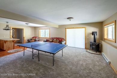 Escape to your own hand-hewn log retreat nestled in the woods of on Star Valley RV Golf Course in Wyoming - for sale on GolfHomes.com, golf home, golf lot
