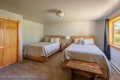Escape to your own hand-hewn log retreat nestled in the woods of on Star Valley RV Golf Course in Wyoming - for sale on GolfHomes.com, golf home, golf lot
