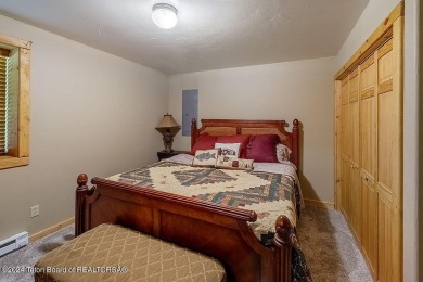 Escape to your own hand-hewn log retreat nestled in the woods of on Star Valley RV Golf Course in Wyoming - for sale on GolfHomes.com, golf home, golf lot
