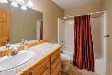 Escape to your own hand-hewn log retreat nestled in the woods of on Star Valley RV Golf Course in Wyoming - for sale on GolfHomes.com, golf home, golf lot