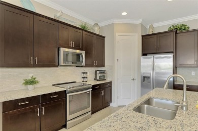 Prepare to be impressed by this meticulously maintained on Sarasota National Golf Club in Florida - for sale on GolfHomes.com, golf home, golf lot