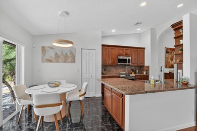 A rare find, 4 bed split on private lot surrounded by shrubs and on Boca Greens Country Club in Florida - for sale on GolfHomes.com, golf home, golf lot