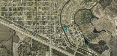 This oversized lot is just a few blocks from SR 82 and backs up on Mirror Lakes Golf Club in Florida - for sale on GolfHomes.com, golf home, golf lot