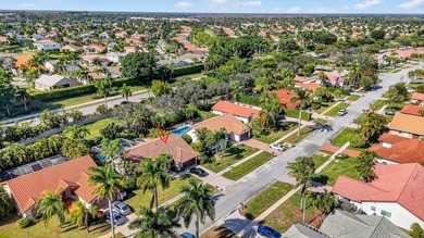 A rare find, 4 bed split on private lot surrounded by shrubs and on Boca Greens Country Club in Florida - for sale on GolfHomes.com, golf home, golf lot