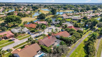 A rare find, 4 bed split on private lot surrounded by shrubs and on Boca Greens Country Club in Florida - for sale on GolfHomes.com, golf home, golf lot