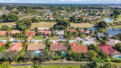A rare find, 4 bed split on private lot surrounded by shrubs and on Boca Greens Country Club in Florida - for sale on GolfHomes.com, golf home, golf lot