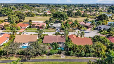 A rare find, 4 bed split on private lot surrounded by shrubs and on Boca Greens Country Club in Florida - for sale on GolfHomes.com, golf home, golf lot