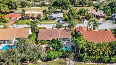 A rare find, 4 bed split on private lot surrounded by shrubs and on Boca Greens Country Club in Florida - for sale on GolfHomes.com, golf home, golf lot