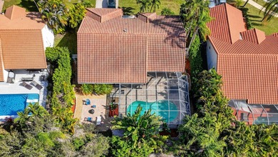 A rare find, 4 bed split on private lot surrounded by shrubs and on Boca Greens Country Club in Florida - for sale on GolfHomes.com, golf home, golf lot