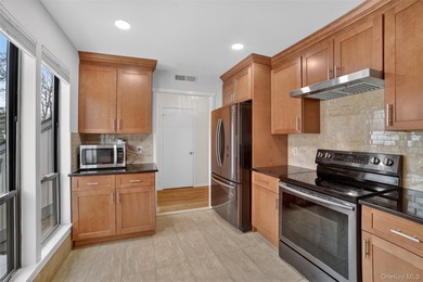 Rare end unit offering a unique and desirable layout with a on Somers Pointe Golf Club - West Hill in New York - for sale on GolfHomes.com, golf home, golf lot