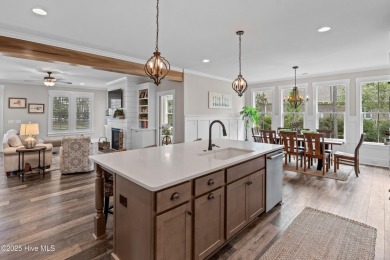 This nearly new residence is situated on a corner lot within the on Members Club At St. James Plantation in North Carolina - for sale on GolfHomes.com, golf home, golf lot
