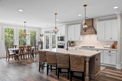 This nearly new residence is situated on a corner lot within the on Members Club At St. James Plantation in North Carolina - for sale on GolfHomes.com, golf home, golf lot