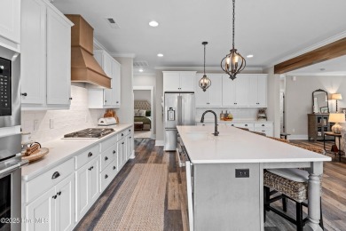This nearly new residence is situated on a corner lot within the on Members Club At St. James Plantation in North Carolina - for sale on GolfHomes.com, golf home, golf lot