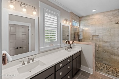 This nearly new residence is situated on a corner lot within the on Members Club At St. James Plantation in North Carolina - for sale on GolfHomes.com, golf home, golf lot