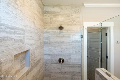 This nearly new residence is situated on a corner lot within the on Members Club At St. James Plantation in North Carolina - for sale on GolfHomes.com, golf home, golf lot