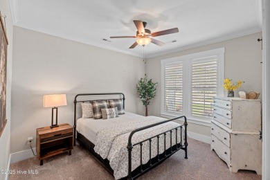 This nearly new residence is situated on a corner lot within the on Members Club At St. James Plantation in North Carolina - for sale on GolfHomes.com, golf home, golf lot
