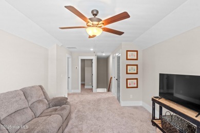 This nearly new residence is situated on a corner lot within the on Members Club At St. James Plantation in North Carolina - for sale on GolfHomes.com, golf home, golf lot
