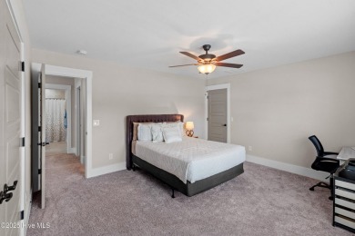 This nearly new residence is situated on a corner lot within the on Members Club At St. James Plantation in North Carolina - for sale on GolfHomes.com, golf home, golf lot