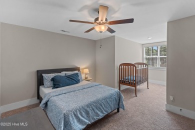 This nearly new residence is situated on a corner lot within the on Members Club At St. James Plantation in North Carolina - for sale on GolfHomes.com, golf home, golf lot