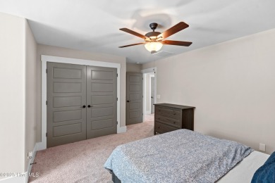This nearly new residence is situated on a corner lot within the on Members Club At St. James Plantation in North Carolina - for sale on GolfHomes.com, golf home, golf lot