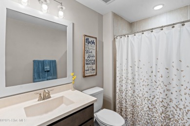 This nearly new residence is situated on a corner lot within the on Members Club At St. James Plantation in North Carolina - for sale on GolfHomes.com, golf home, golf lot