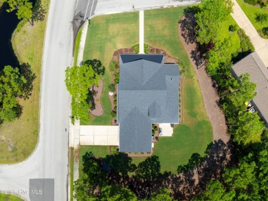 This nearly new residence is situated on a corner lot within the on Members Club At St. James Plantation in North Carolina - for sale on GolfHomes.com, golf home, golf lot