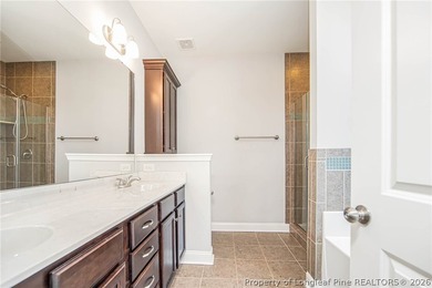 Refined Craftsman nestled in desirable King's Grant Golf & on Kings Grant Golf and Country Club in North Carolina - for sale on GolfHomes.com, golf home, golf lot