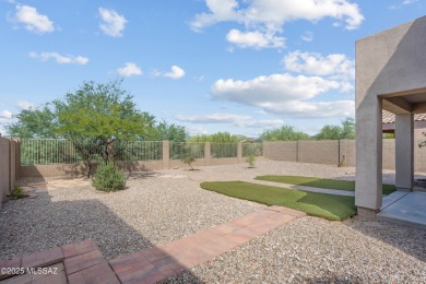 Located in Rancho Vistoso, this Elevation C Plan with Stone sits on The Golf Club at Vistoso in Arizona - for sale on GolfHomes.com, golf home, golf lot