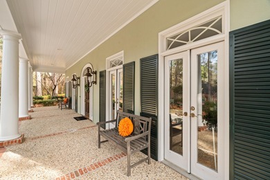 A wood-beamed pavilion, a fire pit glowing under string lights on Canebrake Country Club in Mississippi - for sale on GolfHomes.com, golf home, golf lot