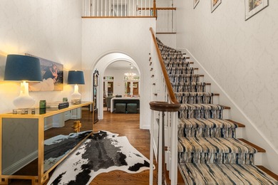 A wood-beamed pavilion, a fire pit glowing under string lights on Canebrake Country Club in Mississippi - for sale on GolfHomes.com, golf home, golf lot