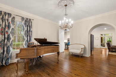 A wood-beamed pavilion, a fire pit glowing under string lights on Canebrake Country Club in Mississippi - for sale on GolfHomes.com, golf home, golf lot