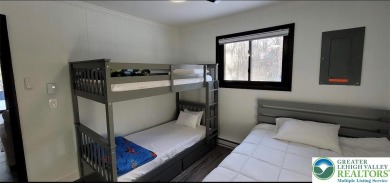 Don't let the outside fool you, this home feels more spacious on Pocono Farms Country Club in Pennsylvania - for sale on GolfHomes.com, golf home, golf lot