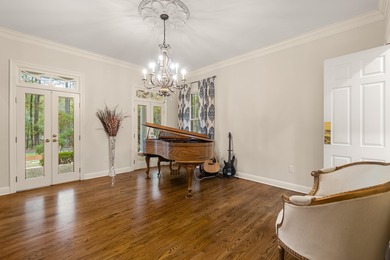 A wood-beamed pavilion, a fire pit glowing under string lights on Canebrake Country Club in Mississippi - for sale on GolfHomes.com, golf home, golf lot