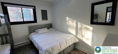 Don't let the outside fool you, this home feels more spacious on Pocono Farms Country Club in Pennsylvania - for sale on GolfHomes.com, golf home, golf lot