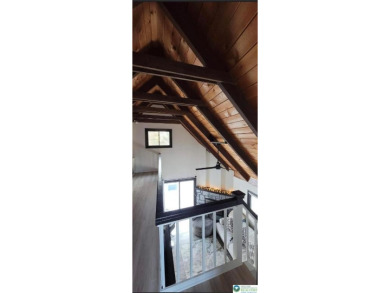 Don't let the outside fool you, this home feels more spacious on Pocono Farms Country Club in Pennsylvania - for sale on GolfHomes.com, golf home, golf lot